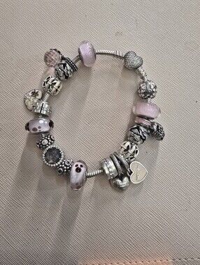 Authentic PANDORA Bracelet With Charms.